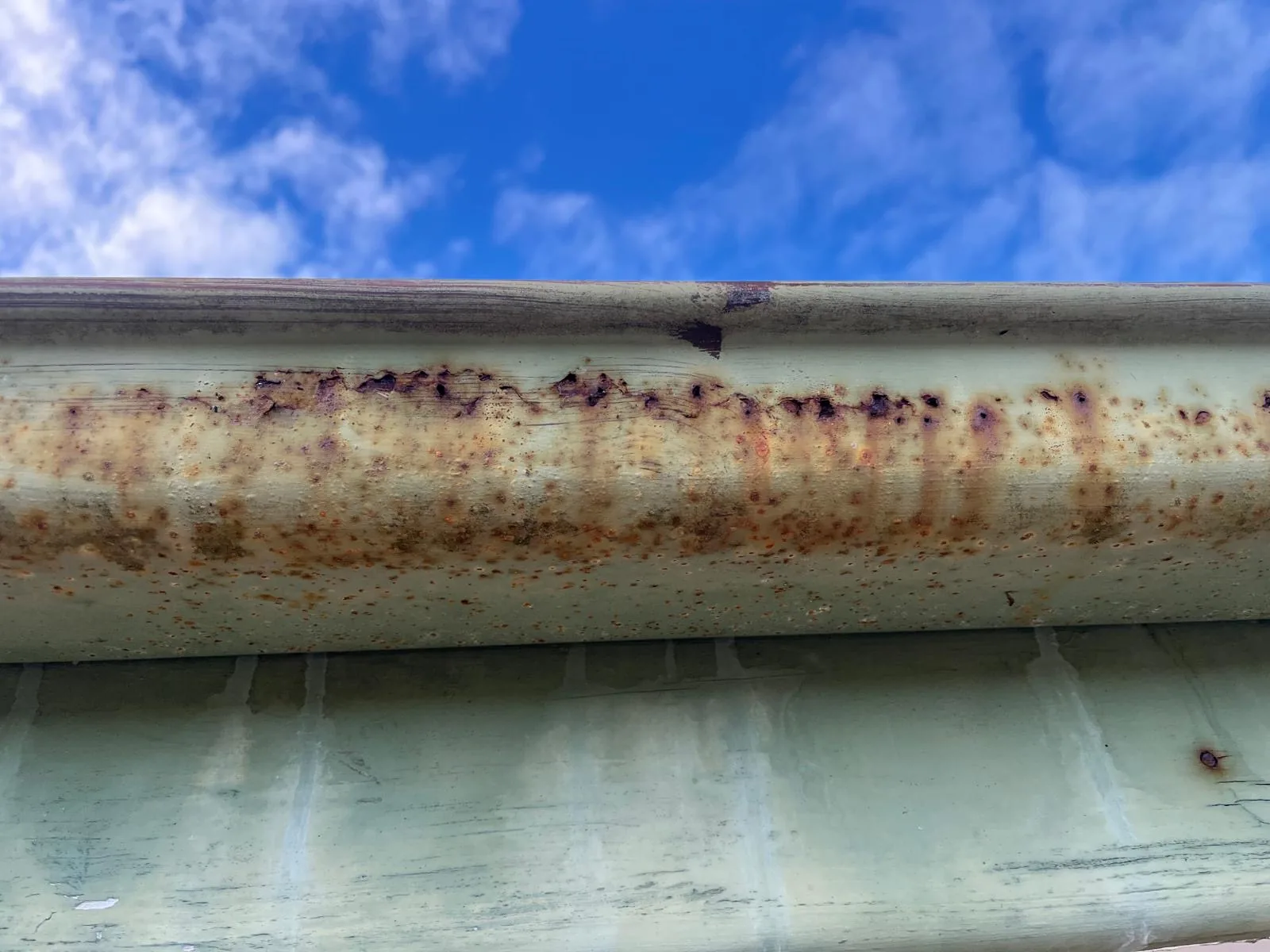 Gutter rusted through along the seam