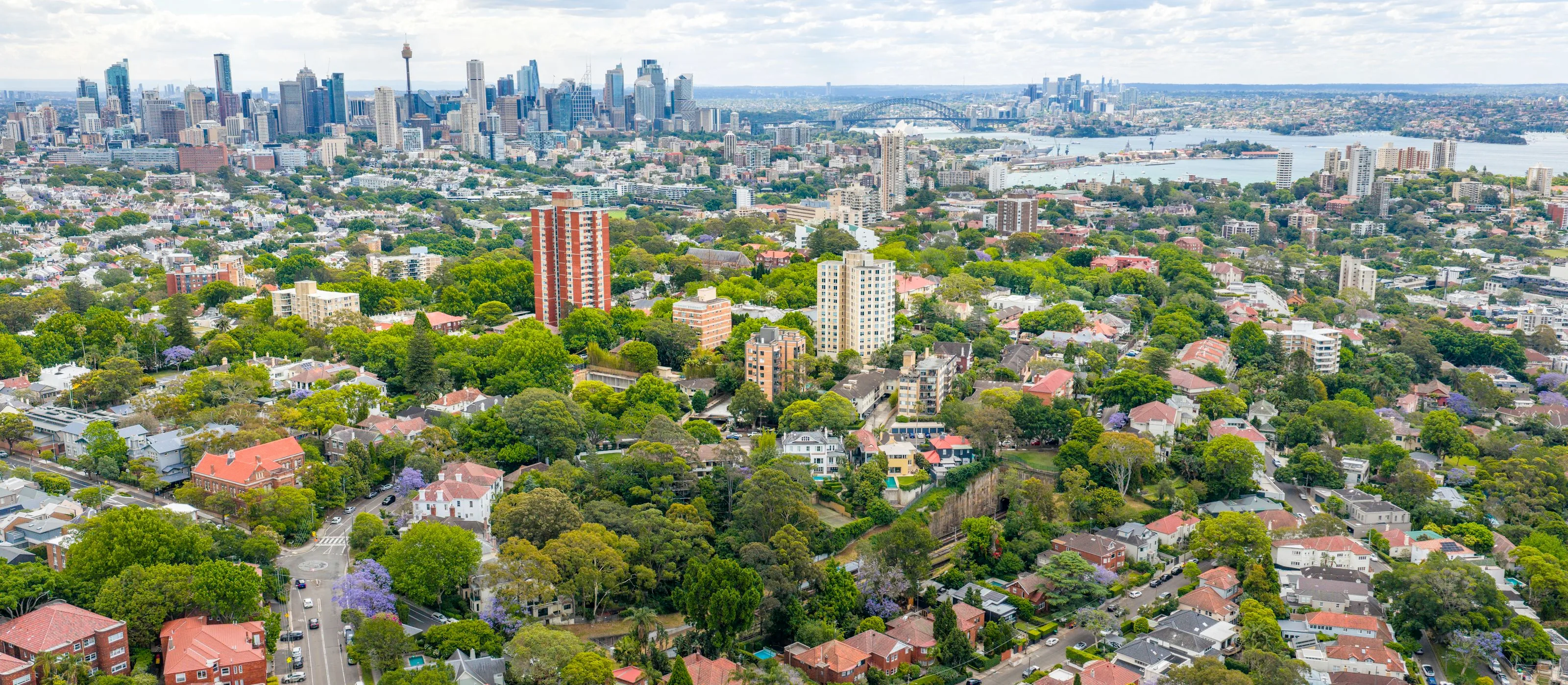 Sydney rooftops stretching toward the CBD skyline