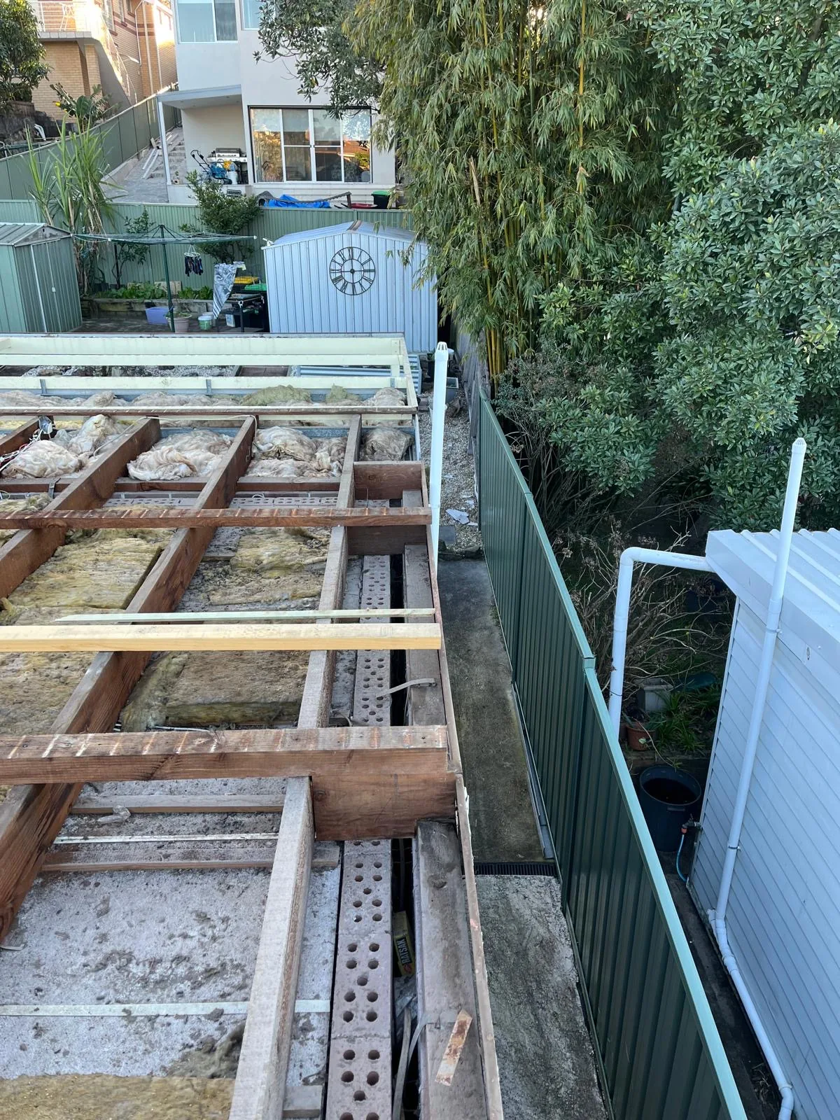 Roof stripped back to bare timber battens during replacement