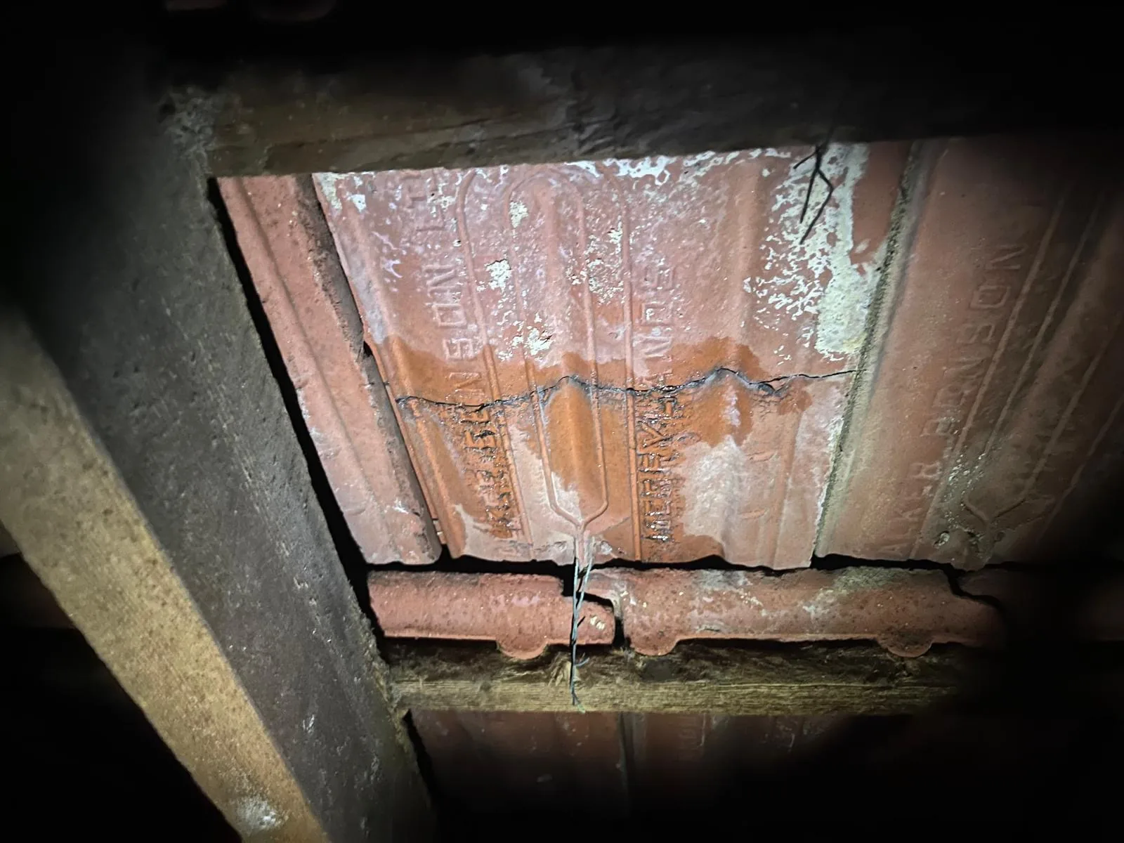 View beneath roof tiles showing the batten and sarking line