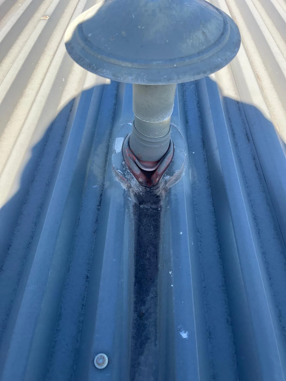 Roof vent penetration with a split, rusted collar